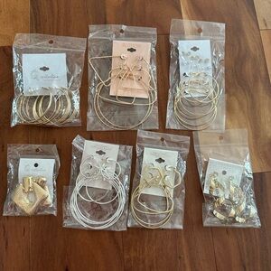 Large group of silvertone and goldtone hoop earrings